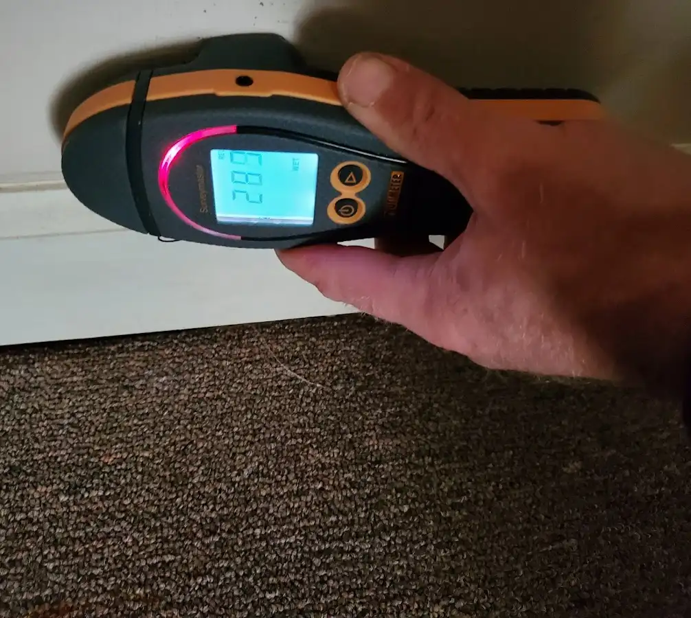 Moisture detection at baseboard during Storm Damage Restoration in South Union
